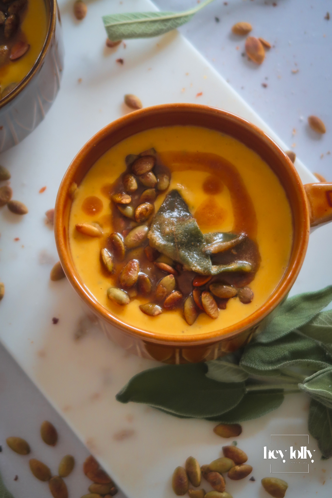 Bowl of Butternut Squash Soup with Sage Brown Butter, crisp sage and toasted pumpkin seeds. 