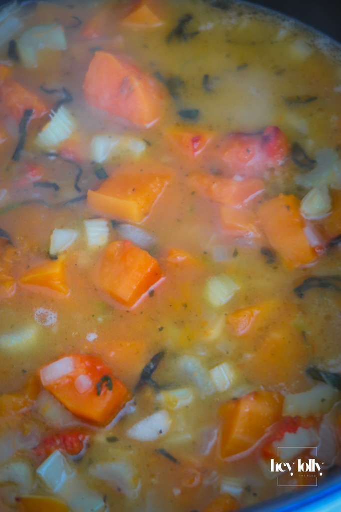 Roasted squash added to the pan with vegetable stock, simmering gently