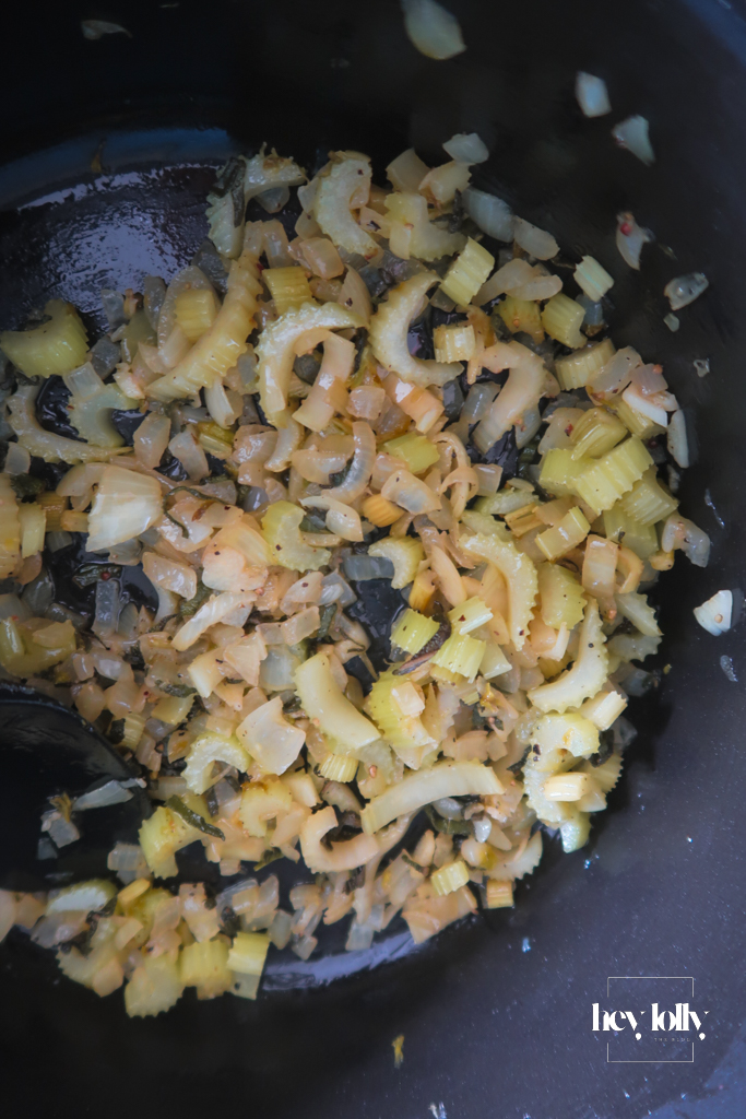 Onion and garlic softening in butter in a saucepan, edges just turning golden