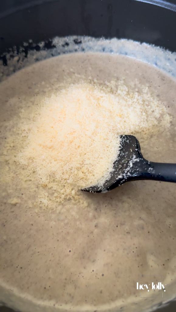 Bowl finished with grated parmesan, extra thyme and a drizzle of olive oil.