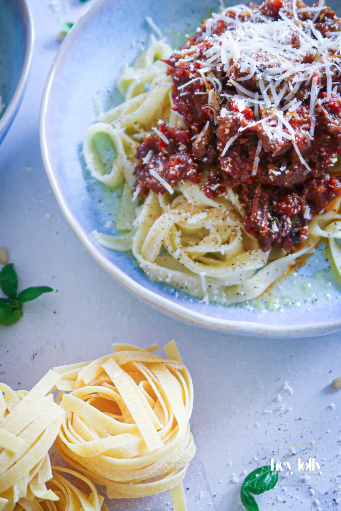 overheadshot of rich beef ragu with tagliatelle