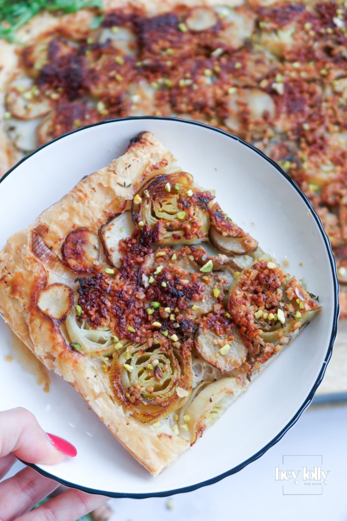 Jerusalem artichoke and leek tart with truffle pesto in a golden shortcrust pastry case