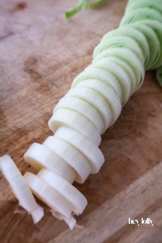 Leeks and onion sliced for Jerusalem artichoke and leek tart filling