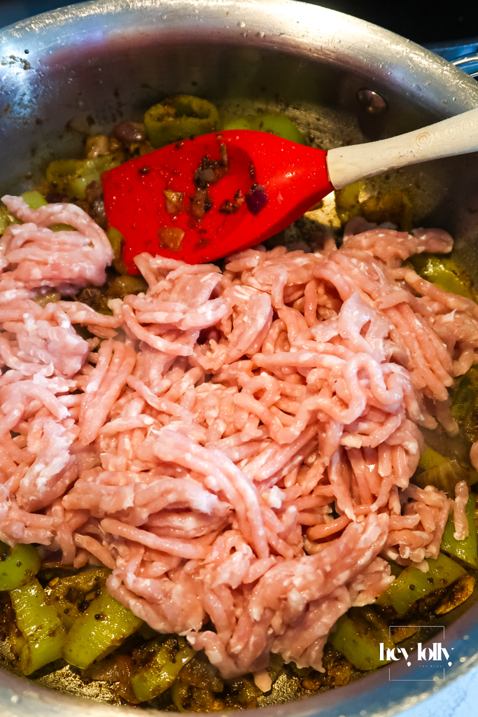 Chicken mince browning in the pan with onions and spices for the keema base