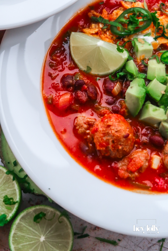 Close-up of smoky Cowboy Taco Soup showing black beans, sweetcorn and charred peppers