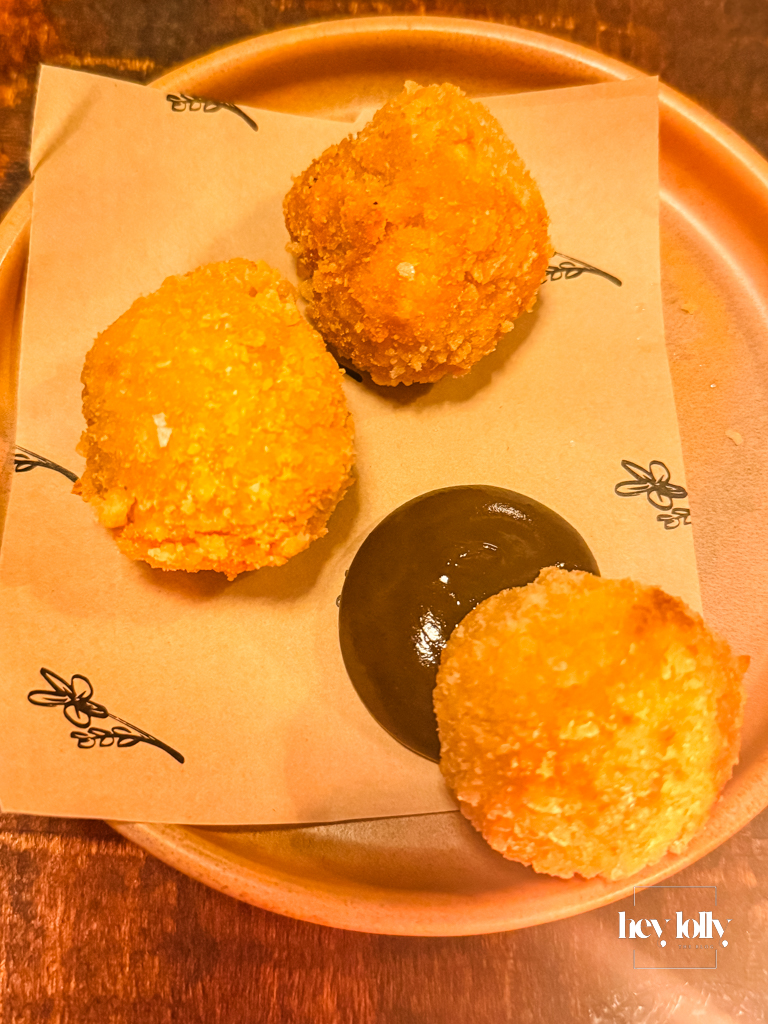 Welsh rarebit croquettes with pickled walnut ketchup on a terracotta plate at Piccalilli
