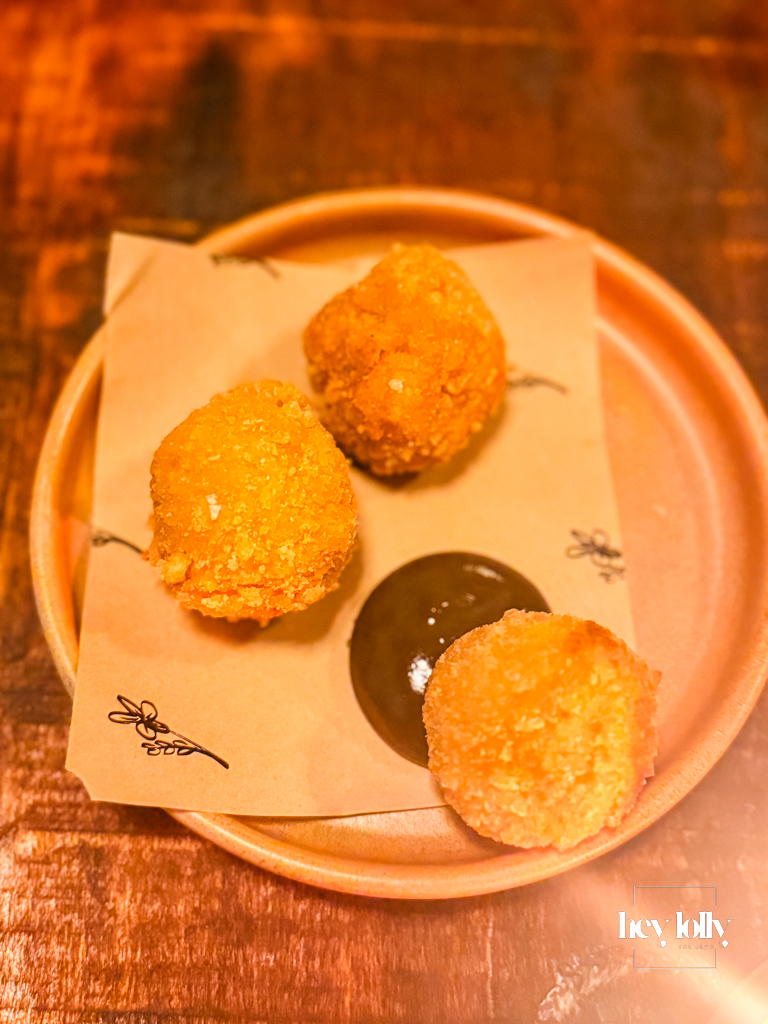 Welsh rarebit croquettes with pickled walnut ketchup on a terracotta plate at Piccalilli