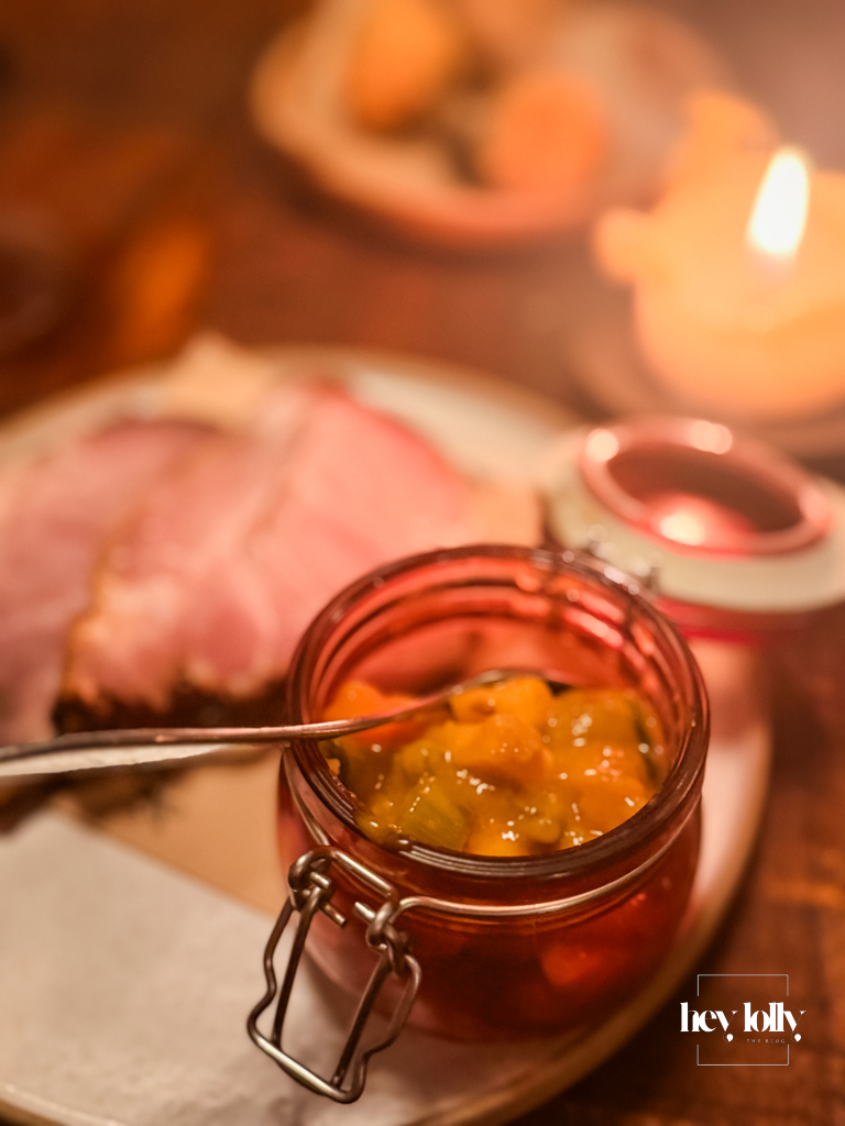 Treacle baked ham with house piccalilli on a candlelit wooden table – Piccalilli Nottingham review