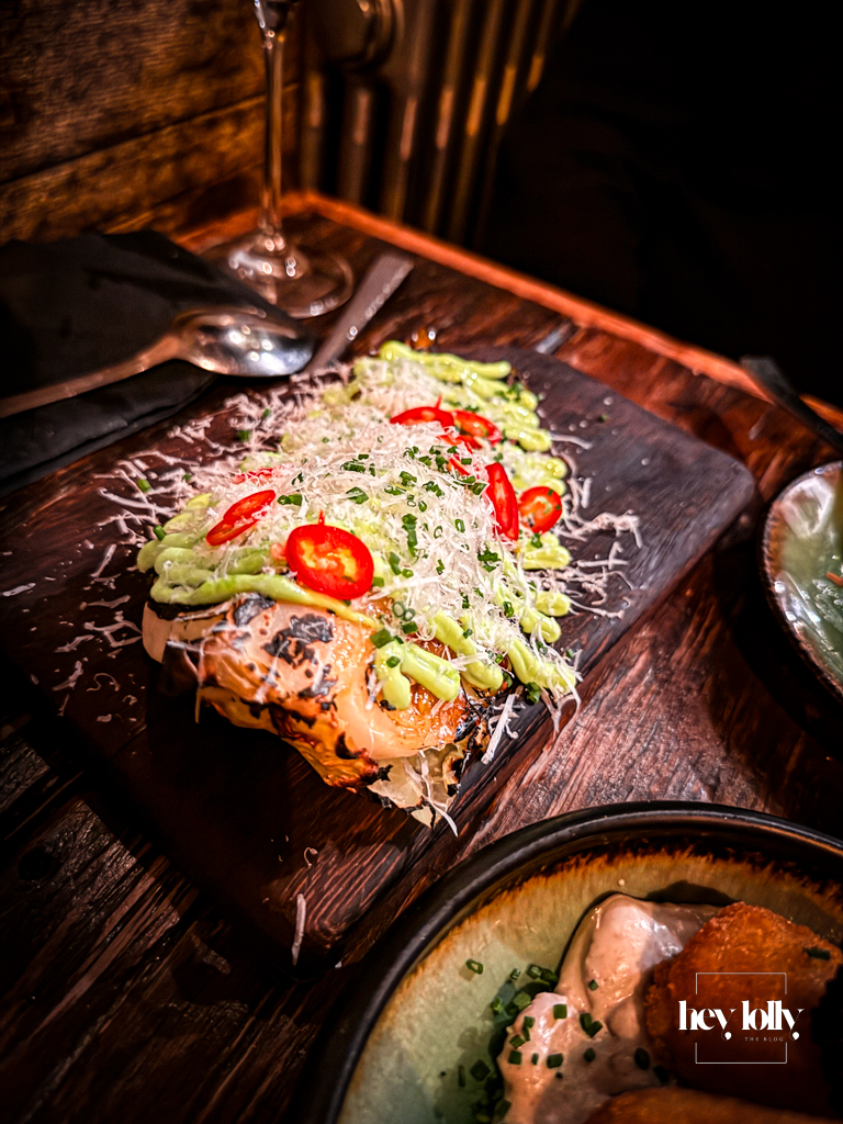 Repollo con Harissa y Queso grilled hispi cabbage at plates by Purnell's