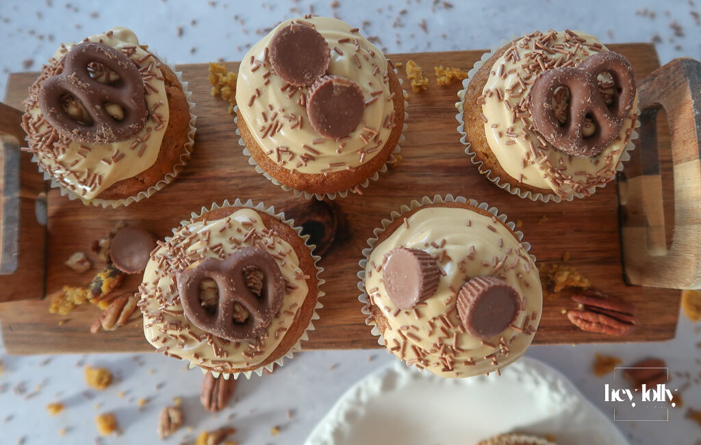 Pumpkin, Maple & Pecan Muffins topped with burnt-butter caramel cream cheese swirls.