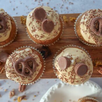Pumpkin, Maple & Pecan Muffins topped with burnt-butter caramel cream cheese swirls.