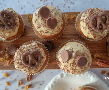 Pumpkin, Maple & Pecan Muffins topped with burnt-butter caramel cream cheese swirls.