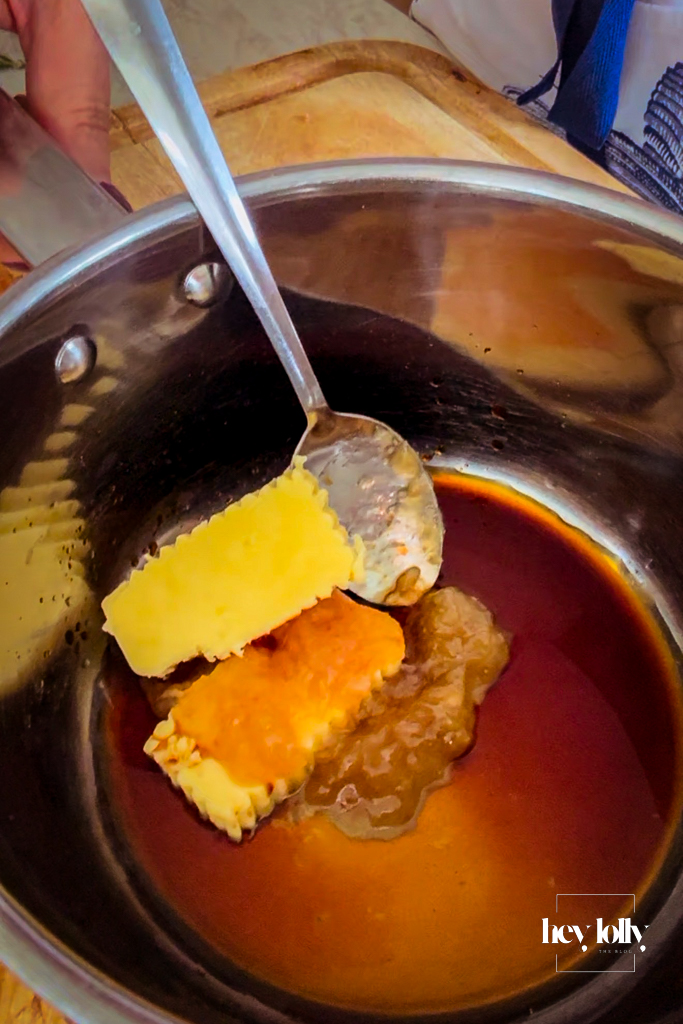 Making the garlic glaze for the pork and stuffing roast bombs.