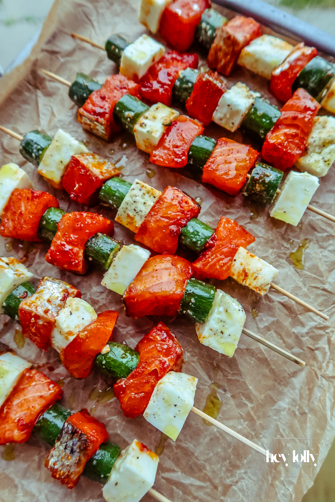 Close-up of even spacing on skewers so salmon halloumi and courgette cook at the same pace.