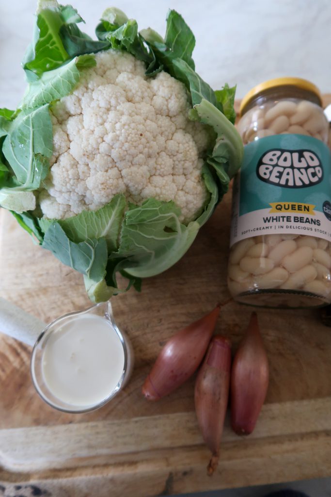 Overhead shot of ingredients for cauliflower and white bean soup