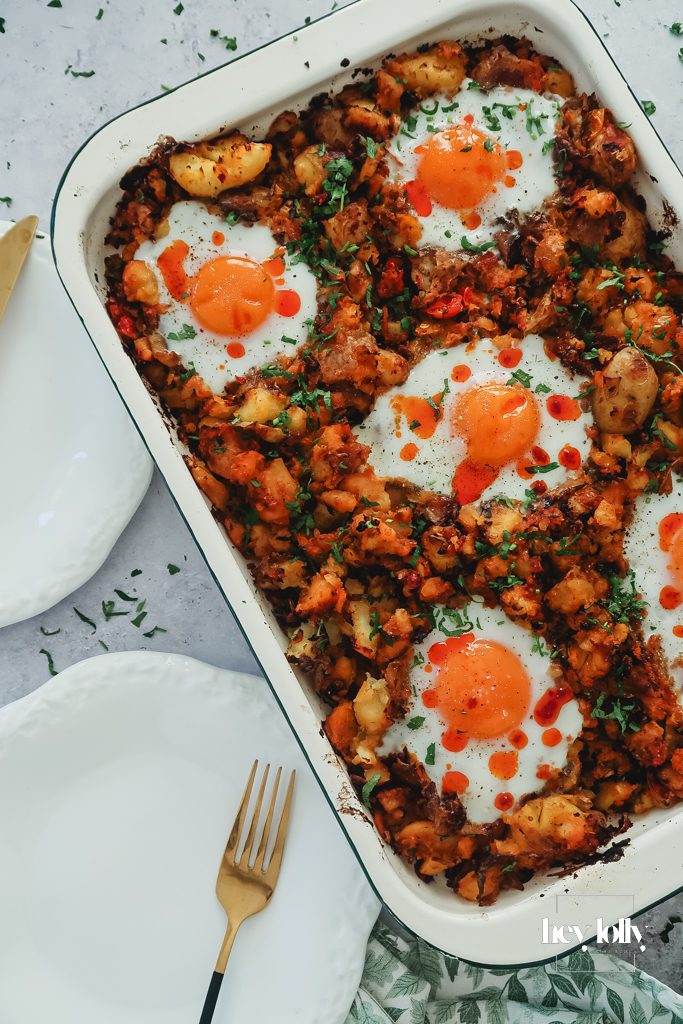 Sprout and harissa potato hash with sunny-side eggs served straight from the pan