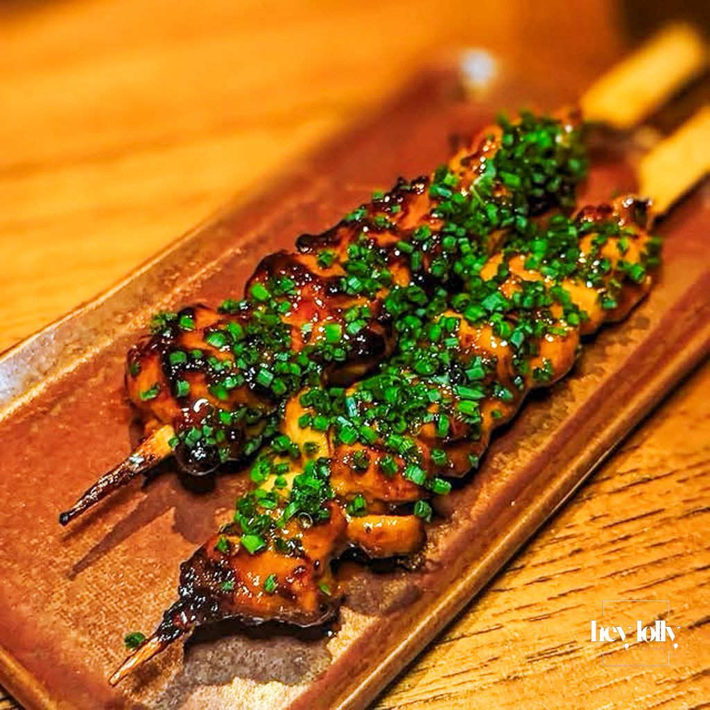 Chicken anticucho skewers served during COYA City bottomless brunch