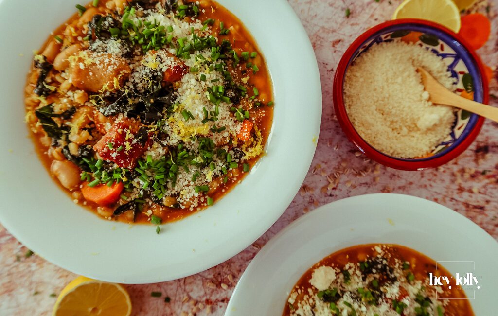 oven on world off pearl barley stew overhead shot in white bowls with grated parmesan and lemon zest