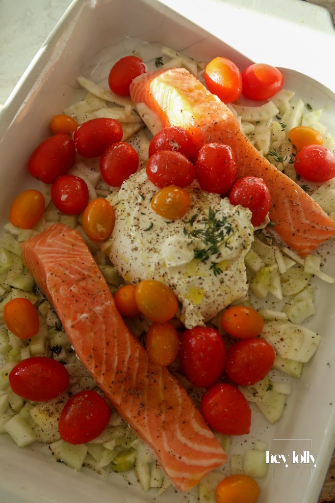 Ingredients for salmon and fennel gnocchi bake laid out including salmon, fennel, cherry tomatoes and cream cheese