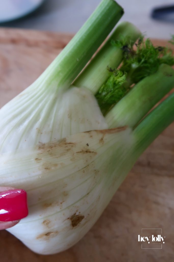 Finely diced fennel prepared for salmon and fennel gnocchi bake on a chopping board