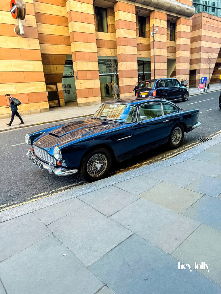 Aston Martin DB4 parked outside the main entrance of The Ned London