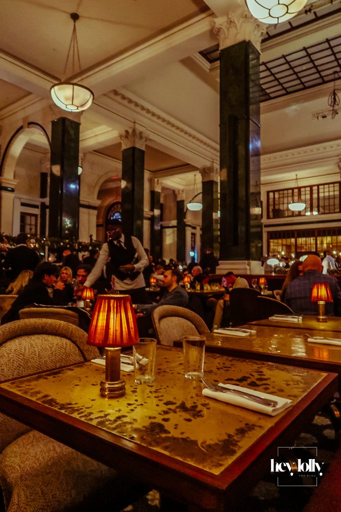 Evening atmosphere in the main bar area at The Ned London