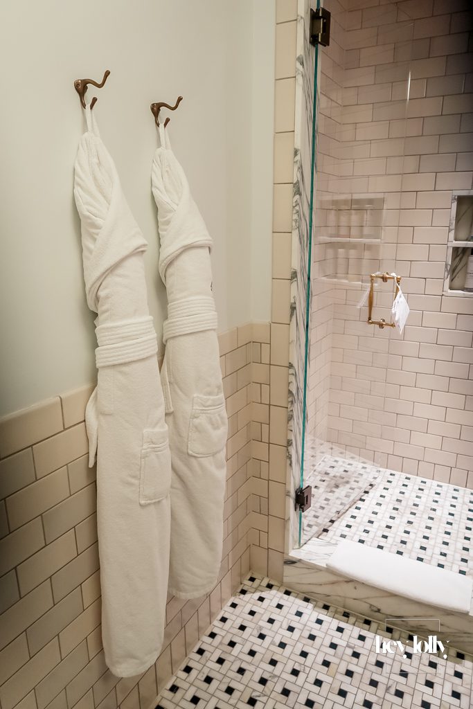 Fluffy robes and towels in The Ned London hotel bathroom