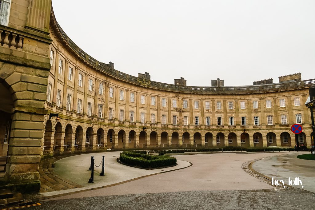 Historic colonnade and stone architecture of Buxton Crescent in the Peak District