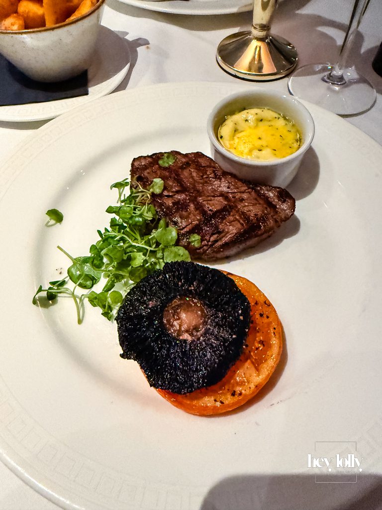 Grilled fillet steak with triple-cooked chips and garlic butter prawns