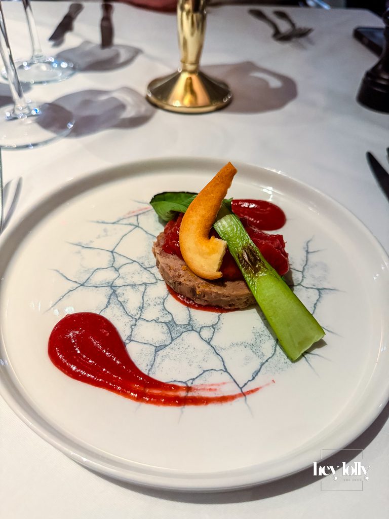 Confit duck terrine with plum gel, mandarin and baby pak choi