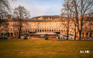 Historic colonnade and stone architecture of Buxton Crescent in the Peak District