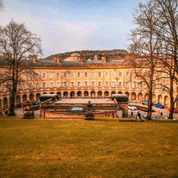 Historic colonnade and stone architecture of Buxton Crescent in the Peak District