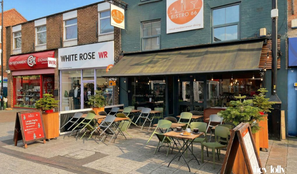 Exterior of Bistro 66 on High Road in Beeston with large front windows and outdoor seating