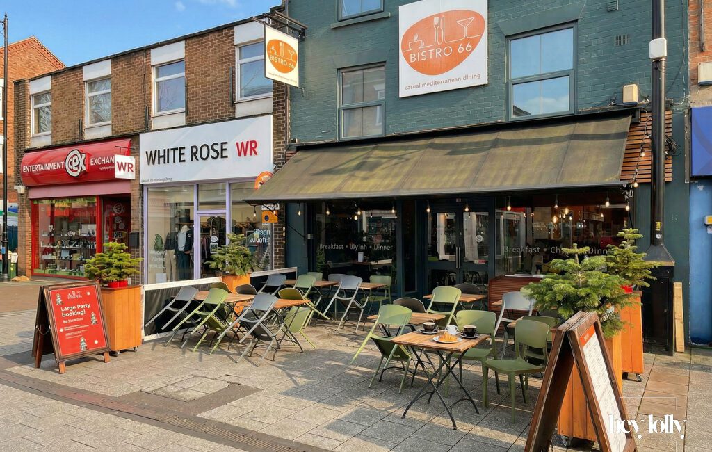 Exterior of Bistro 66 on High Road in Beeston with large front windows and outdoor seating