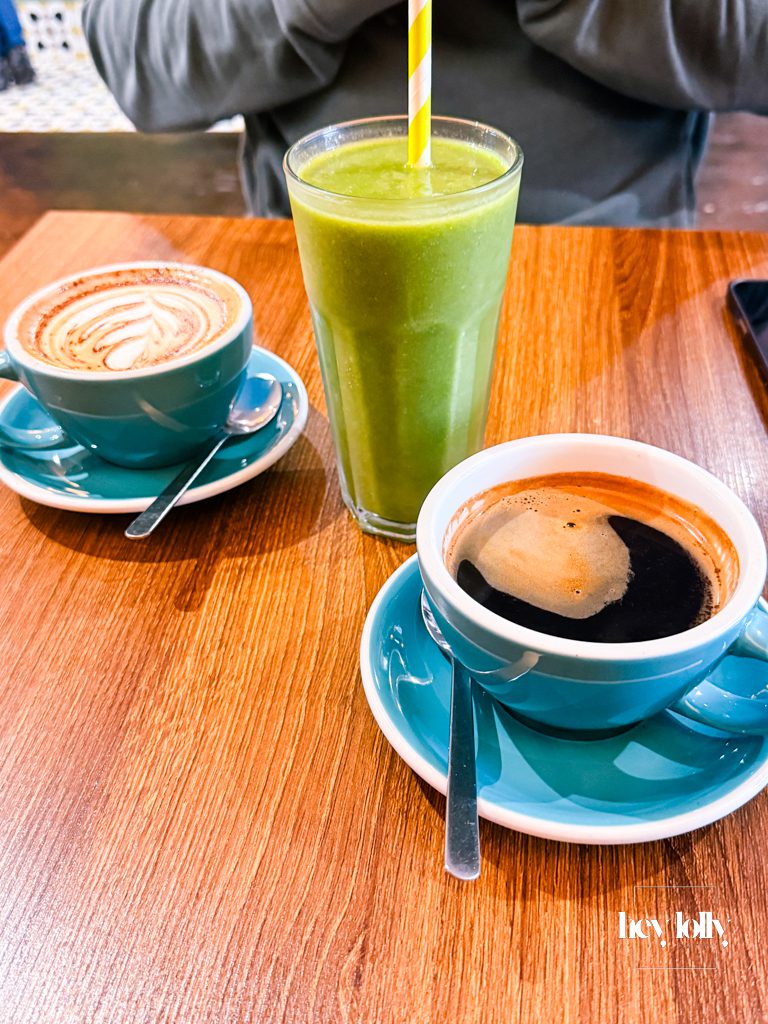 Mocha and black Americano served on a wooden table during brunch at Bistro 66 in Beeston