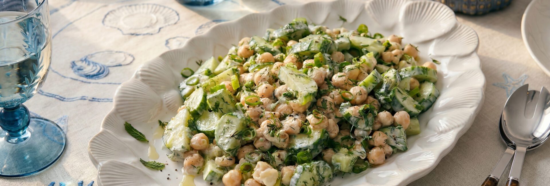 Summer tzatziki chickpea bowl with cucumber, herbs and yogurt dressing served fresh