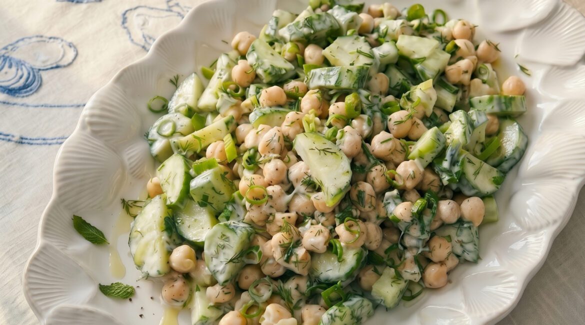Summer tzatziki chickpea bowl with cucumber, herbs and yogurt dressing served fresh