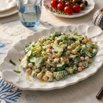 Summer tzatziki chickpea bowl with cucumber, herbs and yogurt dressing served fresh