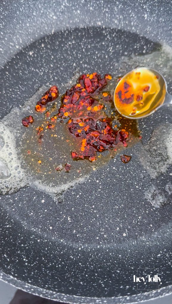 chilli crisp in a pan for smoked salmon breakfast quesadilla