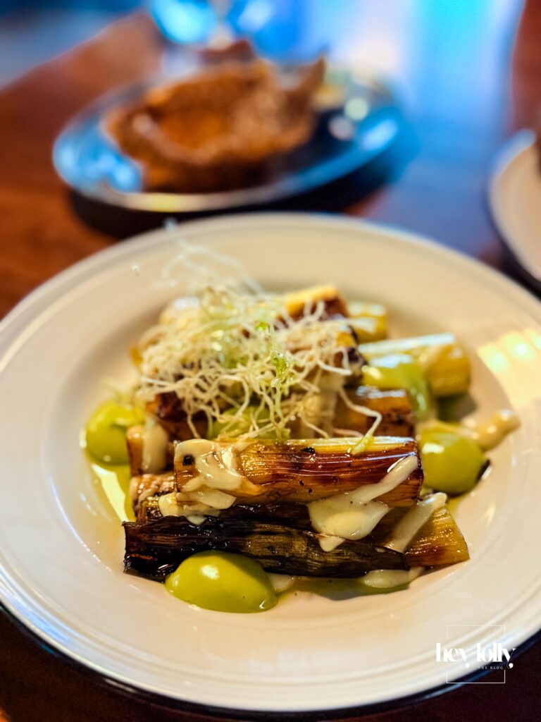 Raymonds Nottingham grilled leeks with dressing close-up