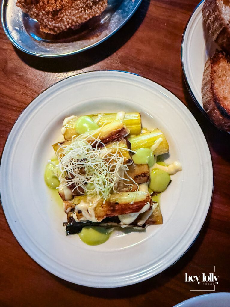 Raymonds Nottingham grilled leeks with dressing close-up